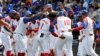 El equipo cubano celebra la victoria sobre Taiwán. (AP/I-Hwa Cheng)
