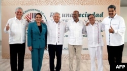 This handout picture released by the Mexican Presidency shows (L-R) Cuban President Miguel Diaz-Canel, Honduran President Xiomara Castro, Mexican President Andres Manuel Lopez Obrador, Haitian Prime Minister Ariel Henry, Colombian President Gustavo Petro