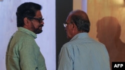 Iván Marquez (izq.) y Humberto de la Calle en La Habana.